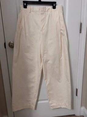 COS men’s wide leg pleated cotton pants.